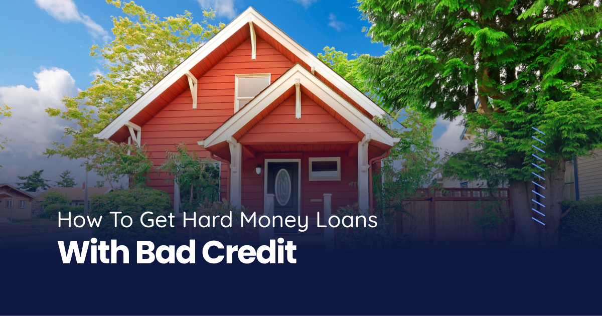 A red single-family home with white trim surrounded by green trees, representing a fix-and-flip investment property.